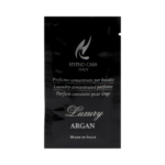 Bustina nera con etichetta "Argan - Monodose Linea Luxury - 10 ml" con testo in italiano, inglese e francese. La scritta "Made in Italy" è stampata in basso a caratteri bianchi.