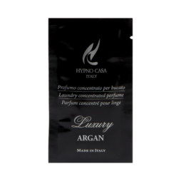 Bustina nera con etichetta "Argan - Monodose Linea Luxury - 10 ml" con testo in italiano, inglese e francese. La scritta "Made in Italy" è stampata in basso a caratteri bianchi.
